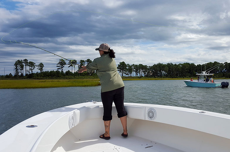 An angler casts her fly line near a marsh in Virginia’s Middle Peninsula. Photo by Susanna Musick