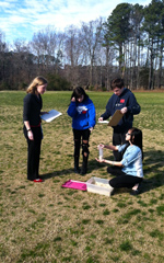 VIMS' Christie Pondell (left) helps the class understand the basics of her research.