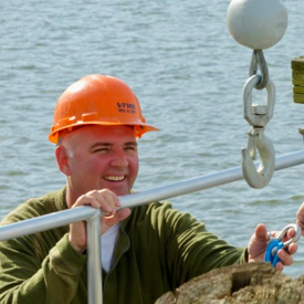 Captain John Olney, Jr. at the rail of the R/V {em}Virginia.{/em}