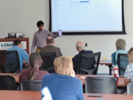 Varun Natarajan, a senior at Maggie L. Walker Governor’s School in Richmond, describes his prototype to the judges. 