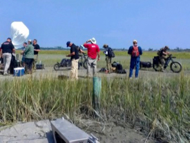  Verizon personnel and contractors test equipment to facilitate communications between the field, staging areas in Wachapreague, and the Incident Command Post in Melfa. © Sean Fate/VIMS ESL.