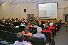 Hershner talks with audience members during a "Planning for the Future" workshop at VIMS in 2012. Attending were local government staff, advisory board members, marine contractors, permitting agents, environmental consultants, and others interested in management of coastal resources. © D. Malmquist.