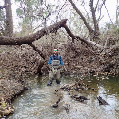 Dr. Chris Patrick surveys ecosystem damage caused by Hurricane Harvey, which dropped more than 40 inches of rain across large swaths of south Texas after it made landfall in 2017. 