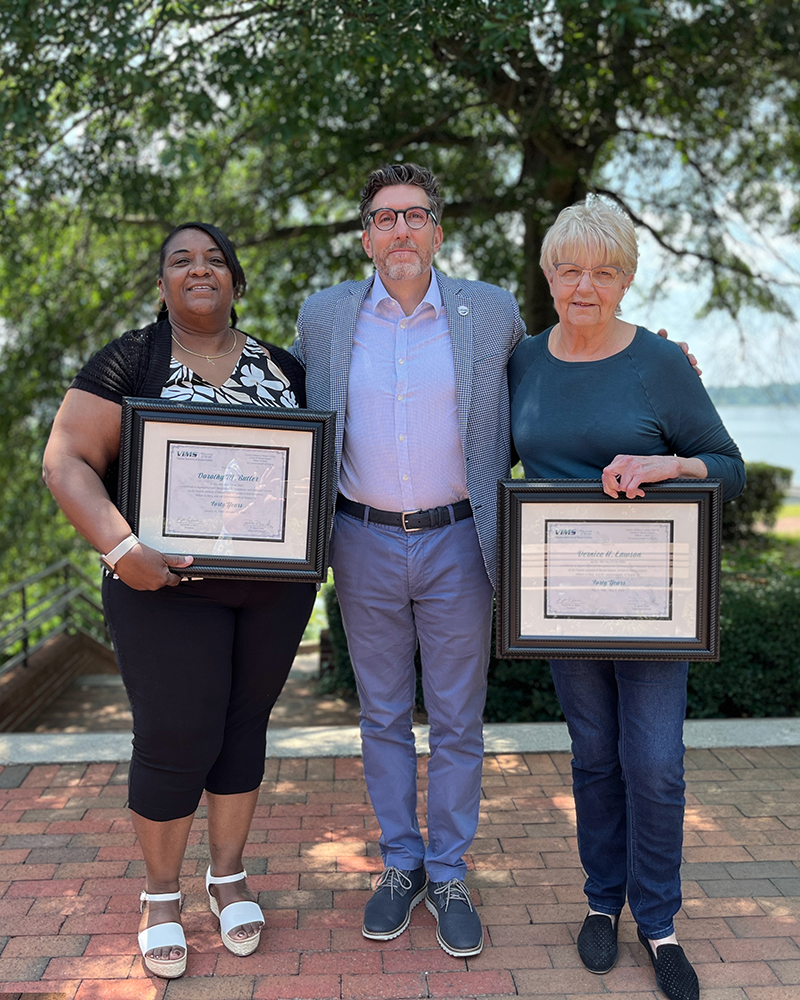 40-Year Service honorees: Maxine Butler and Louise Lawson with Dean and Director Derek Aday.