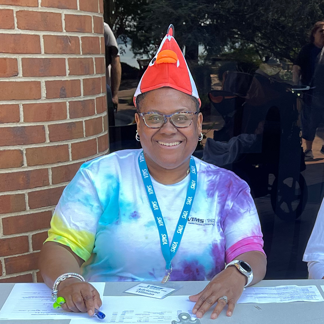 Adrienne volunteering at the costume contest sign-in table at Marine Science Day 2023.