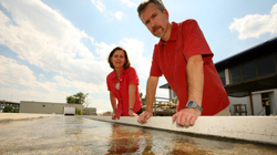 Emmett Duffy and Elizabeth Canuel look over the algae flow-way on the VIMS Gloucester Point campus. Photo by Stephen Salpukas.