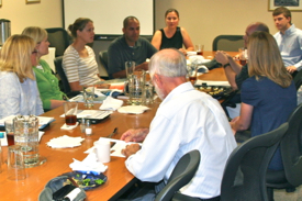 VIMS graduate students describe their educational and research activities with the Secretary and Deputy Secretary during a luncheon meeting at VIMS.