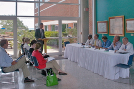 SCHEV director Peter Blake addresses members of the Education Subcommittee of the Virginia Senate Finance Committee during their public meeting at VIMS. From L at table: senators Marsh, Norment, Hanger, Watkins, and Ruff. Photo by Susan Stein.