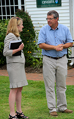 Secretary Ward (left) and CBNERR Director Willy Reay (right) discuss sea level rise during Ward's visit to VIMS.