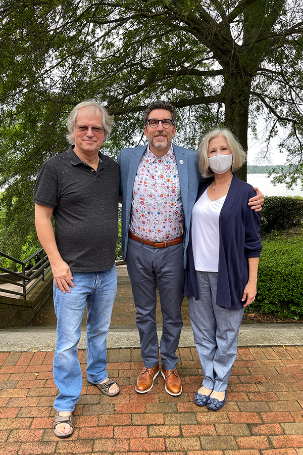 Dr. Roger Mann (L), winner of the 2021 Outstanding Faculty Advisory Award, with Dr. Mary Fabrizio and Dean & Director Dr. Derek Aday.